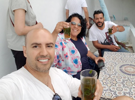 Travelers Unikmaroctours greating with a tea in Hafa Cafe Tangier